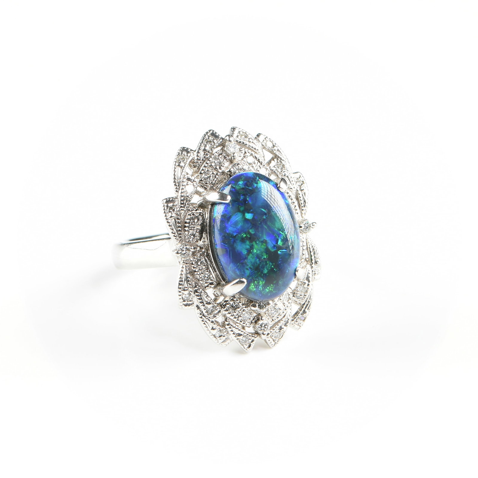 A PLATINUM, AUSTRALIAN BLACK OPAL, AND DIAMOND RING,: A PLATINUM, AUSTRALIAN BLACK OPAL, AND DIAMOND RING, platinum ring set with a 3.02 carat oval double cabochon black opal with vivid blues and greens, accented by melee diamonds, band marked, "PT900
