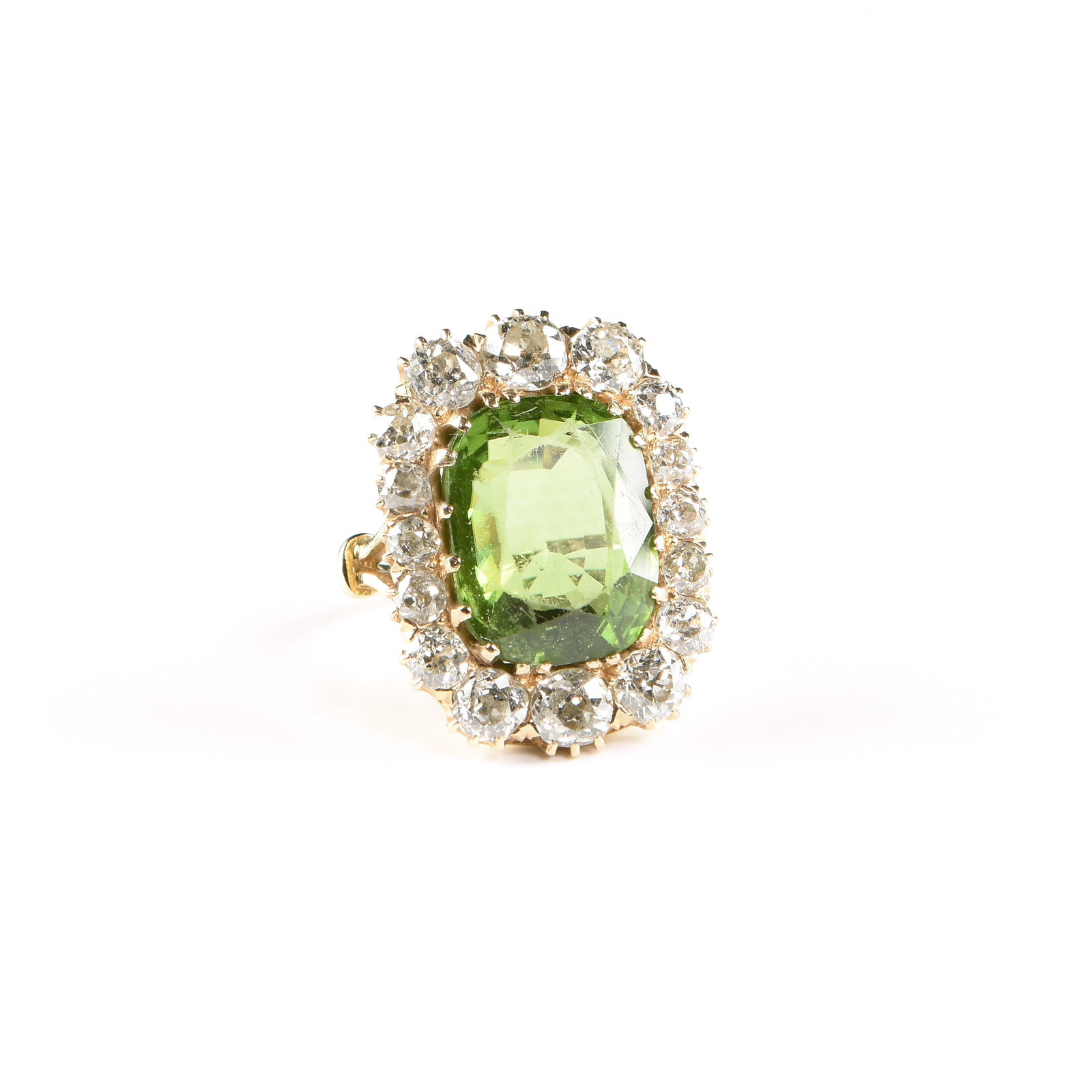 A 14K GOLD, PERIDOT, AND DIAMOND RING, 19TH CENTURY,: A 14K GOLD, PERIDOT, AND DIAMOND RING, 19TH CENTURY, 14k yellow gold ring set with a 10.4 carat rectangular cushion cut peridot surrounded by a halo of sixteen old European cut diamonds (SI2, I-J)