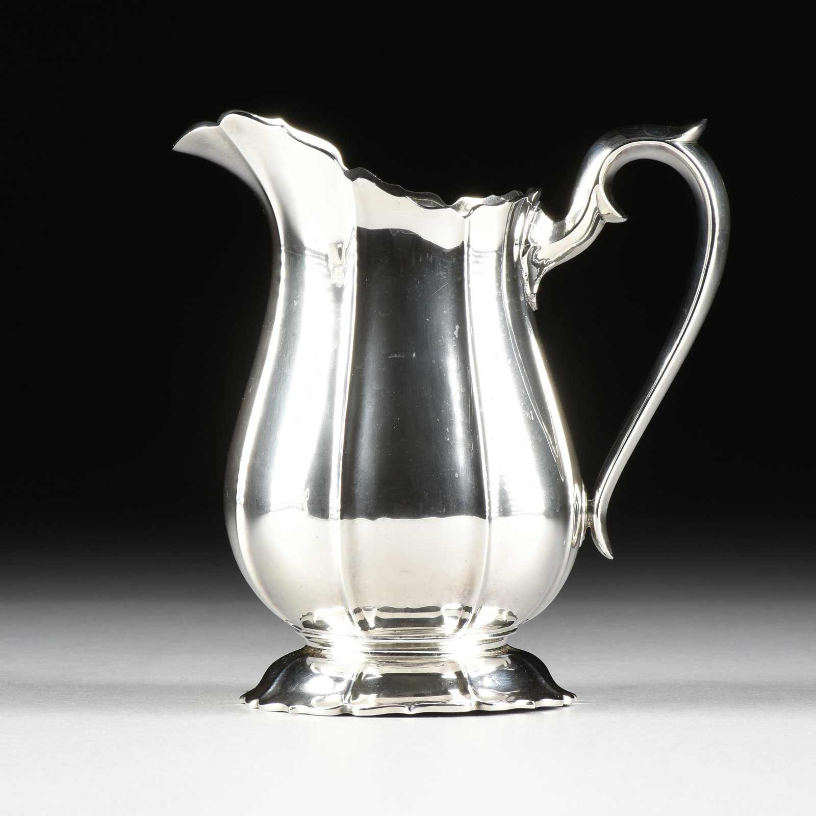 A WATSON STERLING SILVER Irish PITCHER, AMERICAN, EARLY 20TH CENTURY,: A WATSON STERLING SILVER Irish PITCHER, AMERICAN, EARLY 20TH CENTURY, sterling silver fluted pitcher in the Irish pattern, marked on underside, "Sterling A228 / 4 Pints / Irish," and with maker's mark
