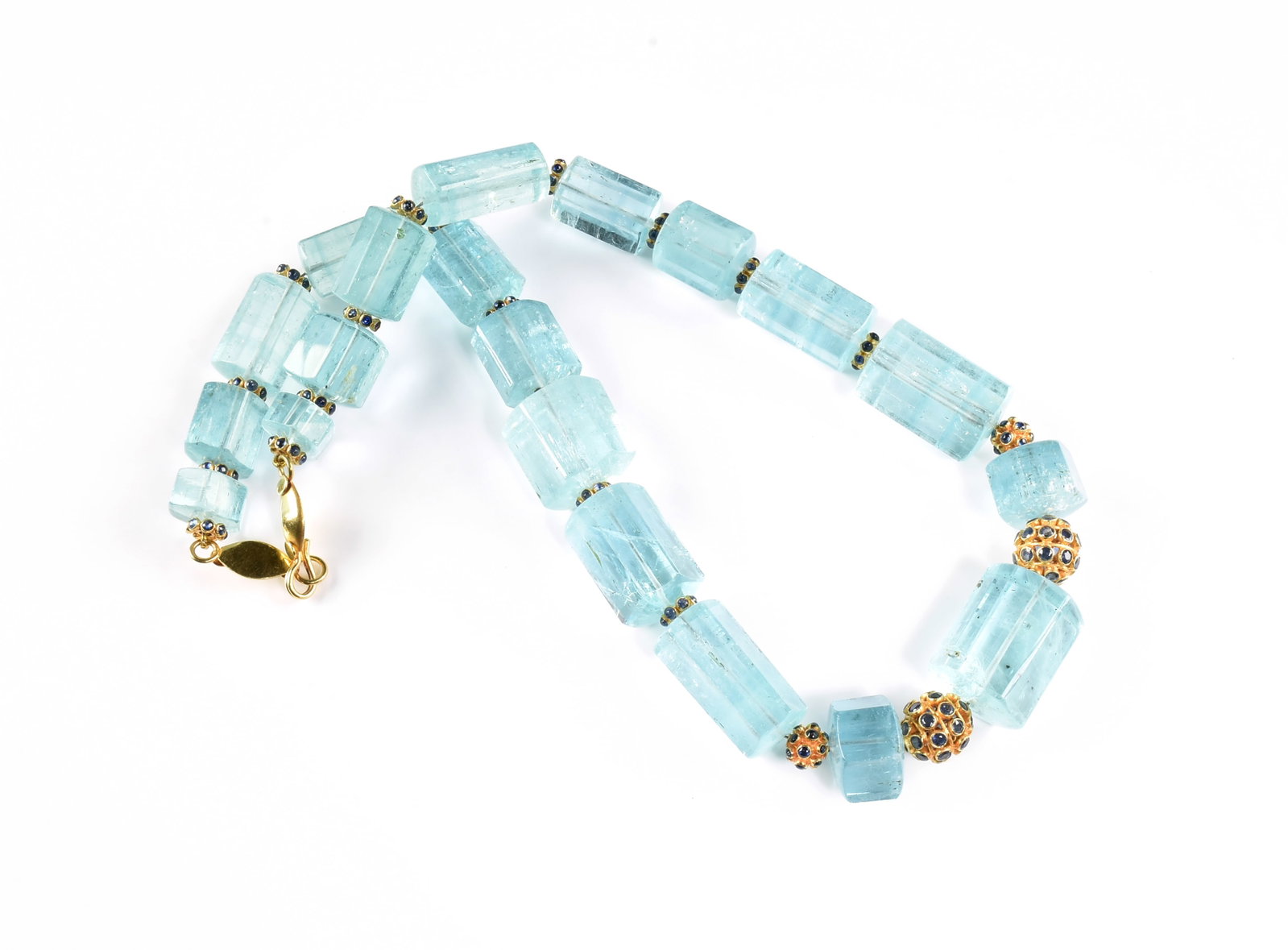AN 18K GOLD, AQUAMARINE, AND SAPPHIRE NECKLACE,: AN 18K GOLD, AQUAMARINE, AND SAPPHIRE NECKLACE, 18k yellow gold necklace with a fish hook clasp, and strung with aquamarine beads, two round gold beads covered with round cut sapphires, and gold round