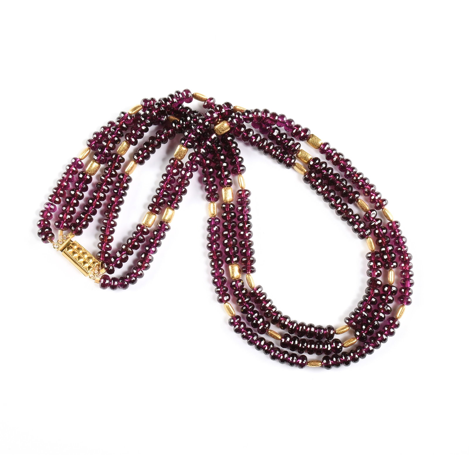 AN 18K GOLD AND GARNET TRIPLE STRAND NECKLACE, (1 of 2)