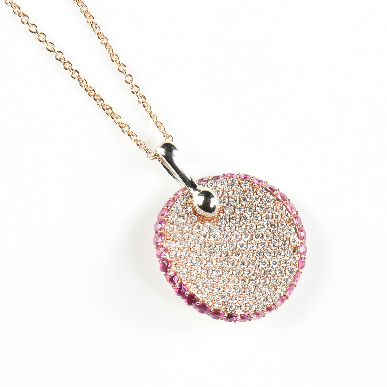 A ROBERTO COIN 18K GOLD, DIAMOND, AND RUBY PENDANT NECKLACE,: A ROBERTO COIN 18K GOLD, DIAMOND, AND RUBY PENDANT NECKLACE, 18k rose gold round pendant with pavé-set round brilliant cut diamonds totaling approximately 0.68 carats (G-H, VSI-VS2) surrounded by