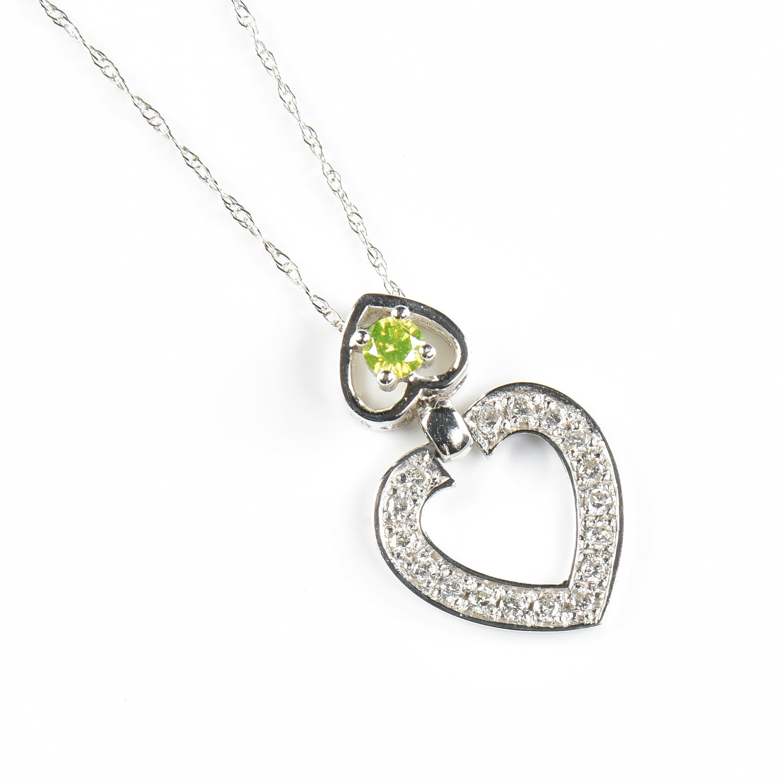 AN 18K GOLD AND DIAMOND HEART PENDANT NECKLACE,: AN 18K GOLD AND DIAMOND HEART PENDANT NECKLACE, 18k white gold heart pendant necklace, with the open heart pendant centering a 0.27 carat round brilliant cut fancy yellow diamond (SII-SI2), and with r