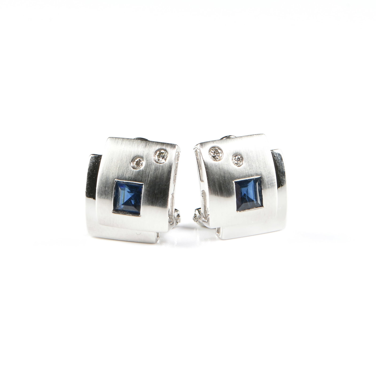 A PAIR OF 14K GOLD, SAPPHIRE, AND DIAMOND EARRINGS,: A PAIR OF 14K GOLD, SAPPHIRE, AND DIAMOND EARRINGS, 14k white gold geometric earrings with brushed and polished finish, each with a square faceted deep blue sapphire (approx. 4 x 4 mm) and two round b