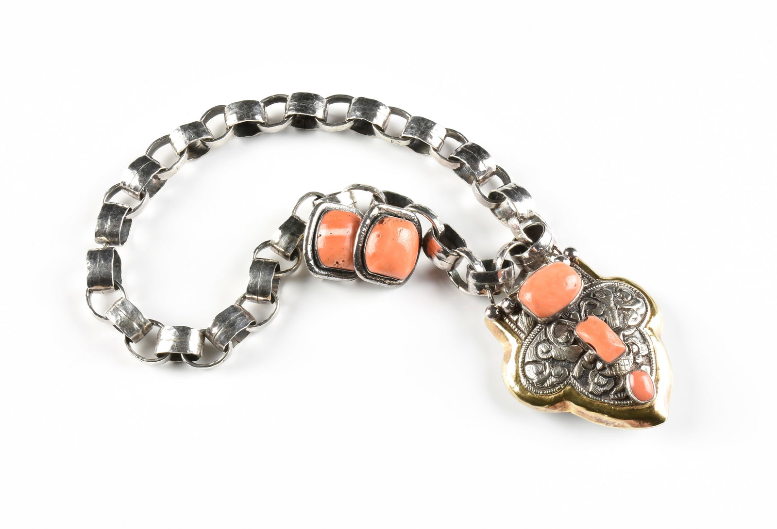 AN ELIZABETH COYNE STERLING SILVER AND CORAL NECKLACE AND EARRINGS, BRITISH,: AN ELIZABETH COYNE STERLING SILVER AND CORAL NECKLACE AND EARRINGS, BRITISH, an arts and crafts style sterling silver necklace with a hammered chain and toggle clasp, with a parcel gilt and engraved s