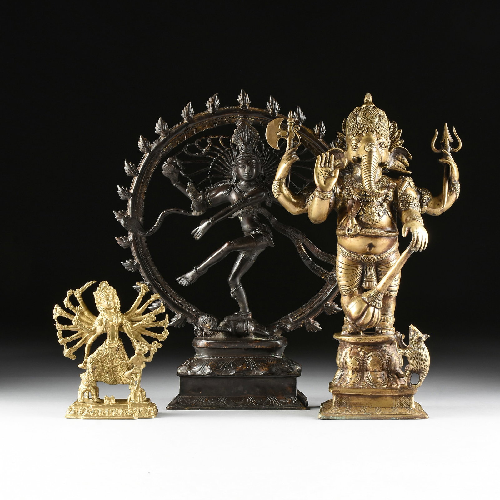 THREE HINDU SCULPTURES, 20TH CENTURY,: THREE HINDU SCULPTURES, 20TH CENTURY, three cast metal sculptures of Hindu deities. Largest: 23 x 20 x 6 1/2 in. (58.4 x 50.8 x 16.5 cm.) Provenance: Private Collection, Houston, Texas.