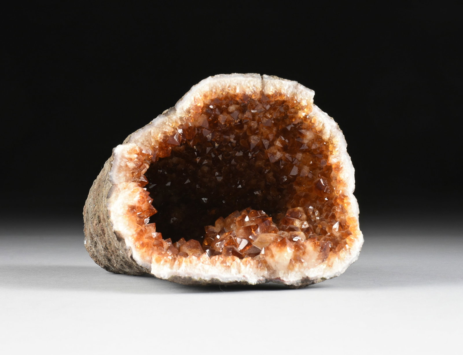 A CITRINE GEODE SPECIMEN,: A CITRINE GEODE SPECIMEN, heated amethyst citrine geode. Total approximate weight: 8.0 lbs 6 1/2 x 7 x 10 in. (16.5 x 17.8 x 25.4 cm.) Provenance: Property of a Gentleman, Fredericksburg, Texas.
