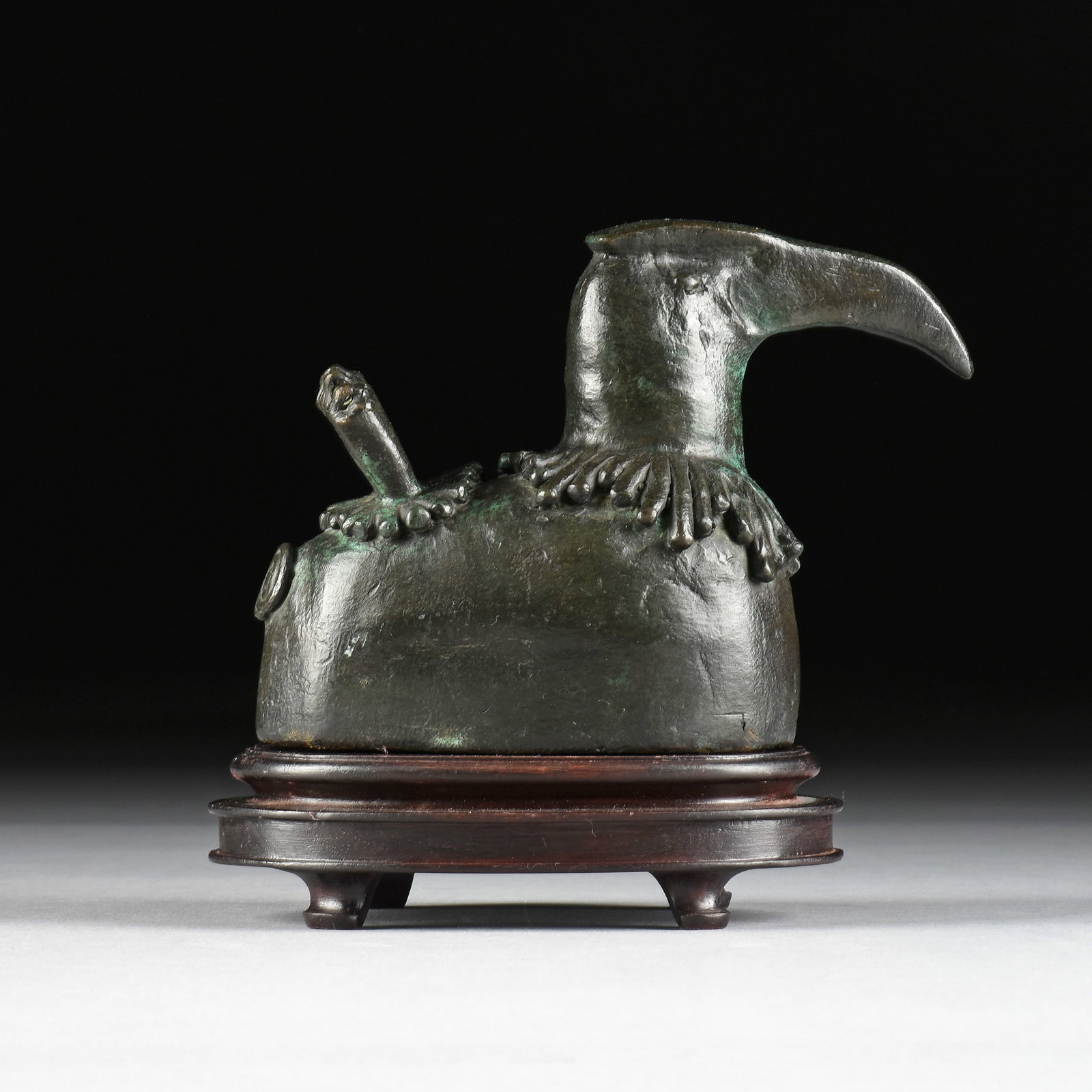 JESSE SIFUENTES (American/Texas b. 1954) Greater Hornbill, LATE 20TH CENTURY,: JESSE SIFUENTES (American/Texas b. 1954) Greater Hornbill, LATE 20TH CENTURY, patinated bronze sculpture of a bird. 5 1/2 x 8 x 4 in. (14 x 20.3 x 10.2 cm.) Provenance: Estate of a Prominent