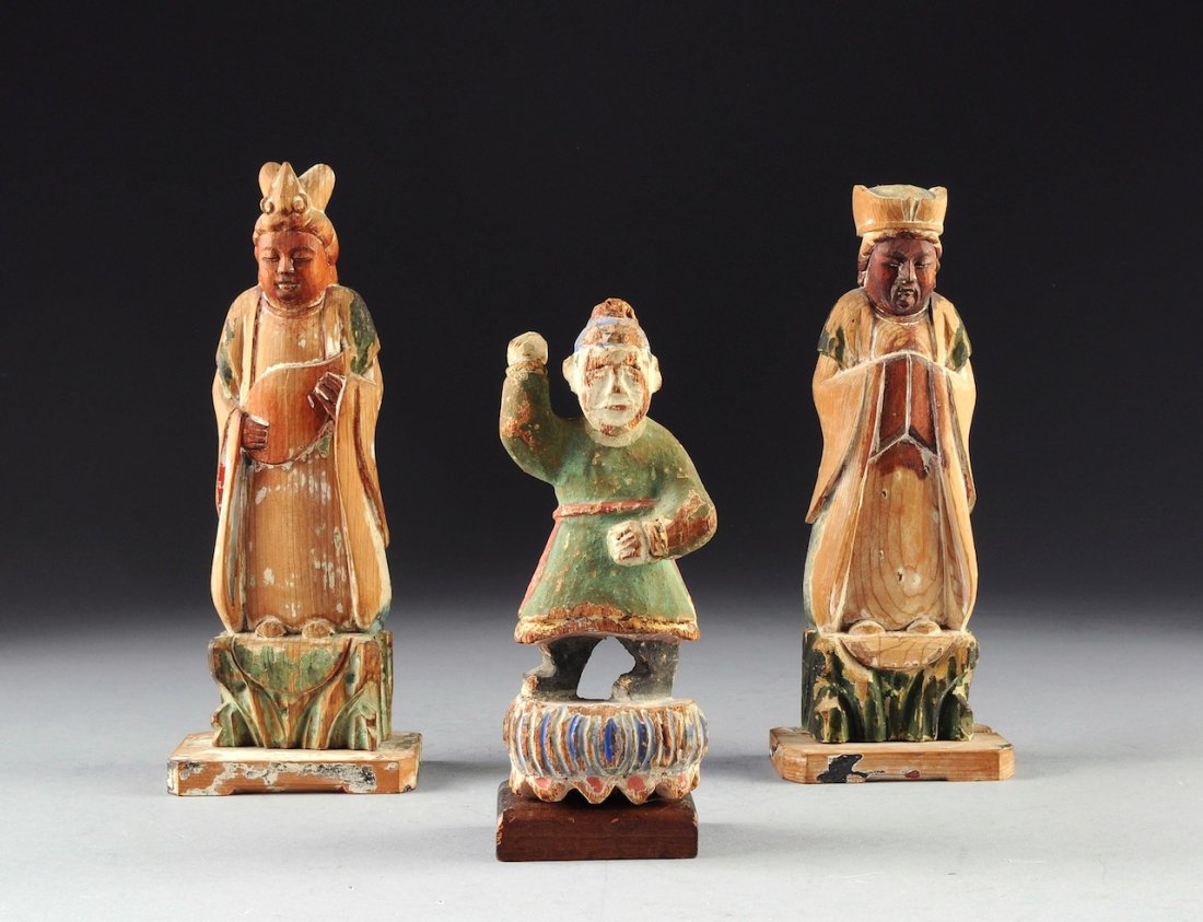 A GROUP OF THREE VINTAGE CHINESE POLYCHROME PAINTED CAR: A GROUP OF THREE VINTAGE CHINESE POLYCHROME PAINTED CARVED WOOD ALTAR FIGURES, REPUBLIC PERIOD (1912-1949), two having rows of black ink character mark inscriptions on underside. Height: 8 1/4" Width: