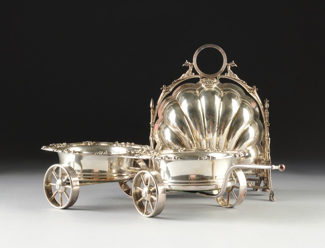 TWO VICTORIAN SILVER PLATED SERVING WARES, 19TH CENTURY: TWO VICTORIAN SILVER PLATED SERVING WARES, 19TH CENTURY, a Sheffield double coaster trolley with tapering circular coasters having a flat rim of stylized shell and blossom cast details above conformin