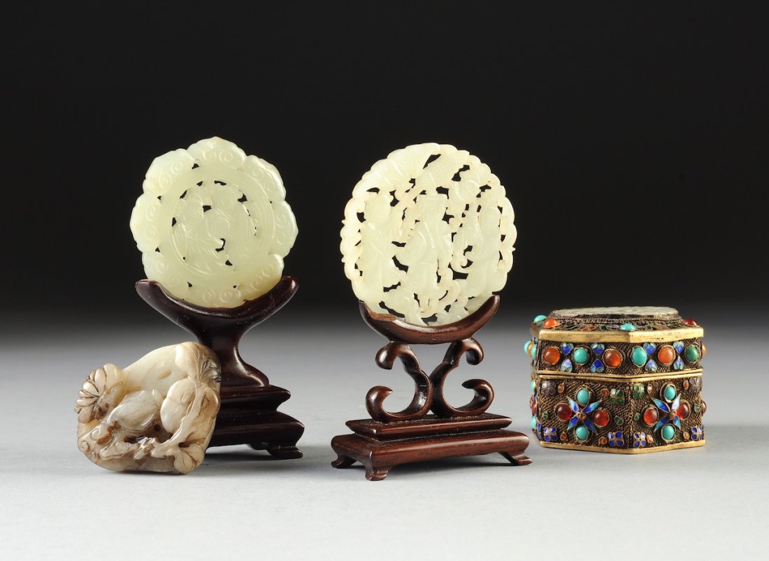 A MISCELLANEOUS GROUP OF FOUR CHINESE CARVED JADE PLAQU: A MISCELLANEOUS GROUP OF FOUR CHINESE CARVED JADE PLAQUES, 20TH CENTURY, comprising a circular white jade reticulated plaque of translucent consistent color with incised details and centering a bearde