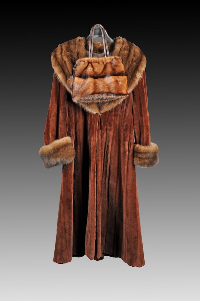 A GIVENCHY BEAVER AND MINK FLOOR LENGTH COAT WITH MATCH: A GIVENCHY BEAVER AND MINK FLOOR LENGTH COAT WITH MATCHING PURSE, sold by Sakowitz, the coat with wide mink opera shawl collar and mink cuffs against a full length beaver fur body, with pockets, appro
