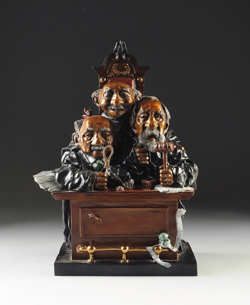 CHARLES BRAGG (American b. 1931), A BRONZE SCULPTURE, ": CHARLES BRAGG (American b. 1931), A BRONZE SCULPTURE, "Court of Appeals," Three judges sitting in a chair with guillotine back and podium stand. Small devils with skulls in a bucket can be seen behind
