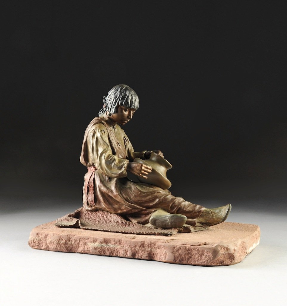 JUAN DELL (American/Texas b. 1933) A POLYCHROME PATINAT: JUAN DELL (American/Texas b. 1933) A POLYCHROME PATINATED BRONZE SCULPTURE, "Santa Clara Potter." signed in the bronze, (c) 81, 11/35, raised on a shaped rectangular sandstone base. Purchased from Gal