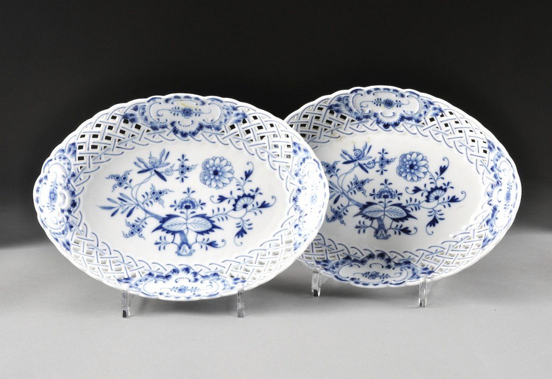 A PAIR OF MEISSEN BLUE ONION GRADUATED AND PIERCED SERV: A PAIR OF MEISSEN BLUE ONION GRADUATED AND PIERCED SERVING DISHES, BLUE CROSSED SWORDS AND "33" MARKS, PRESSENUMMERS 2, 42, 96, 89, each of oval form with reticulated basket weave borders partitioned