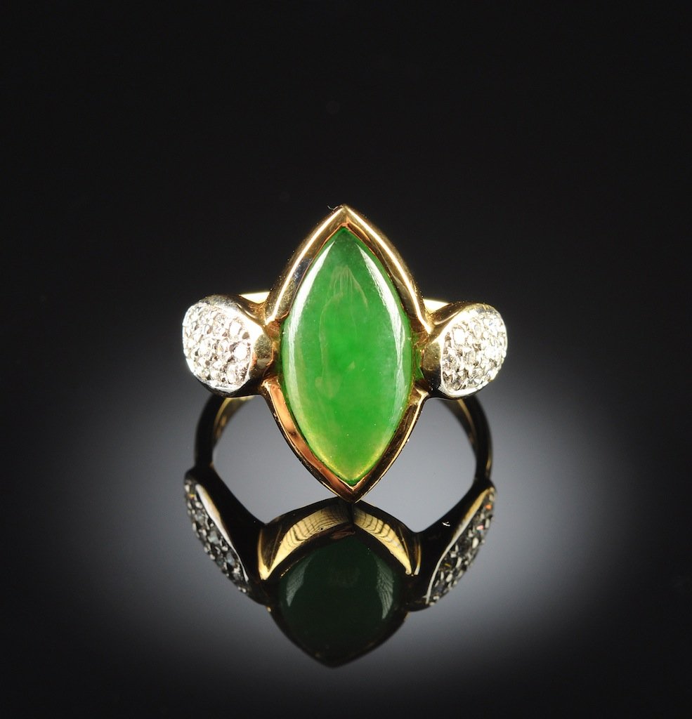 AN 18K YELLOW GOLD, CHINESE "A" JADEITE JADE, AND DIAMO: AN 18K YELLOW GOLD, CHINESE "A" JADEITE JADE, AND DIAMOND LADY'S RING, the mounting centering a natural Type "A" jadeite jade marquise shaped stone measuring approximately 8.0 x 15.8 x 2.8 millimeters