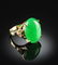 A 14K GOLD PLATED AND APPLE GREEN JADE LADY'S RING, the