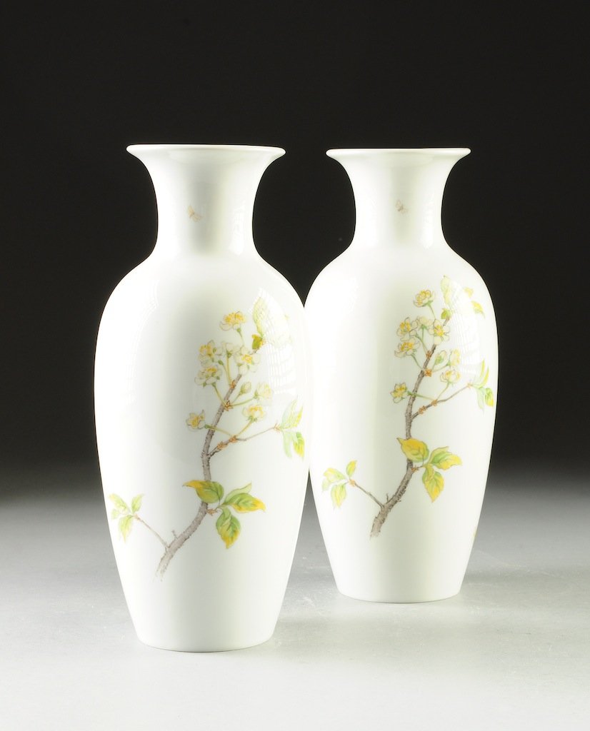 A PAIR OF NYMPHENBURG HAND PAINTED PORCELAIN VASES, LAT: A PAIR OF NYMPHENBURG HAND PAINTED PORCELAIN VASES, LATE 19TH CENTURY, each of baluster form with everted lip and ovoid body, hand painted on white ground with delicate flowering branches and yellow b