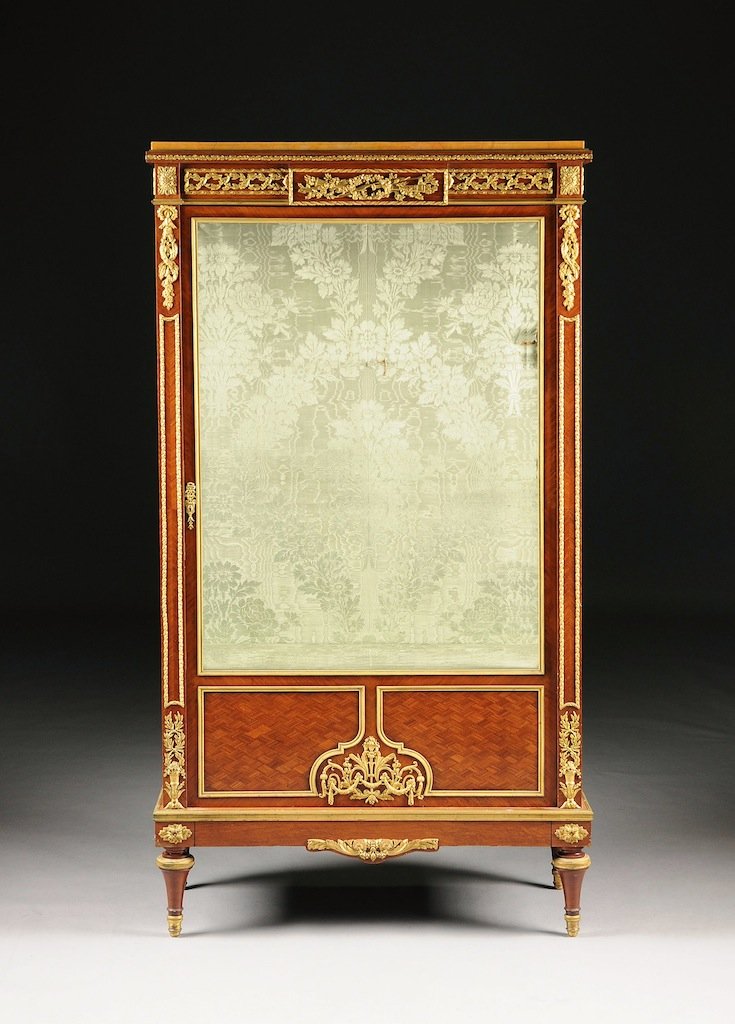 A FINE LOUIS XVI STYLE CAST AND CHASED GILT BRONZE MOUN: A FINE LOUIS XVI STYLE CAST AND CHASED GILT BRONZE MOUNTED TULIPWOOD PARQUETRY VITRINE, IN THE MANNER OF FRANÇOIS LINKE, LATE 19TH/EARLY 20TH CENTURY, the rectangular faux siena marble top above a pa