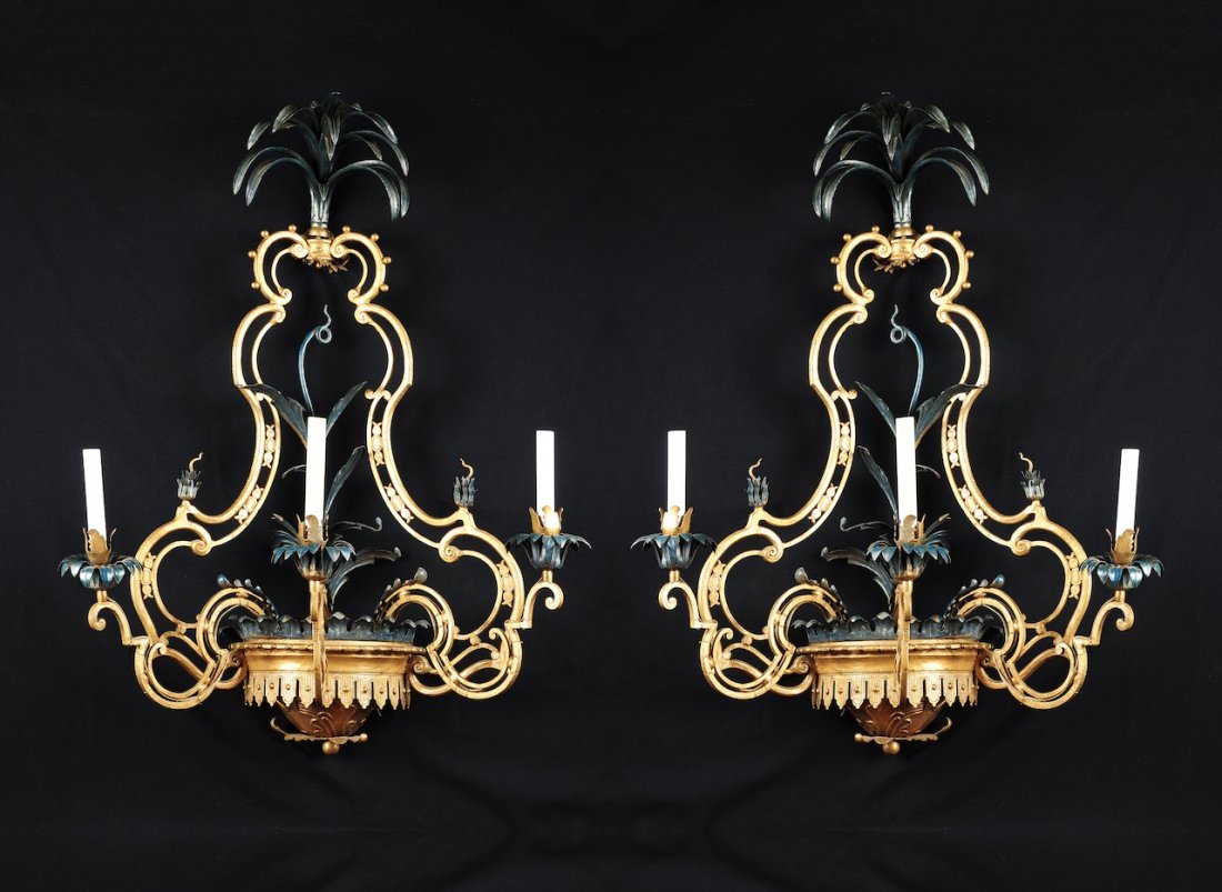 A PAIR OF FRENCH WROUGHT IRON AND TOLE PEINTE THREE-LIG: A PAIR OF FRENCH WROUGHT IRON AND TOLE PEINTE THREE-LIGHT WALL APPLIQUES, THIRD QUARTER 19TH CENTURY, in the Rococo Revival taste, en suite with the preceding lot. Height: 38" Width: 28 1/2" Depth: 18