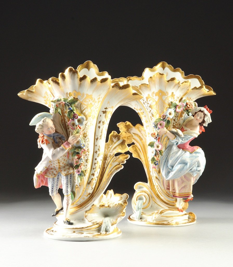 A PAIR OF JACOB PETIT PARCEL GILT AND POLYCHROME PAINTE: A PAIR OF JACOB PETIT PARCEL GILT AND POLYCHROME PAINTED FIGURAL SPILL VASES, INCISED "JP", MID 19TH CENTURY, each modeled as a youth or maiden wearing 18th Century attire and standing on a conforming