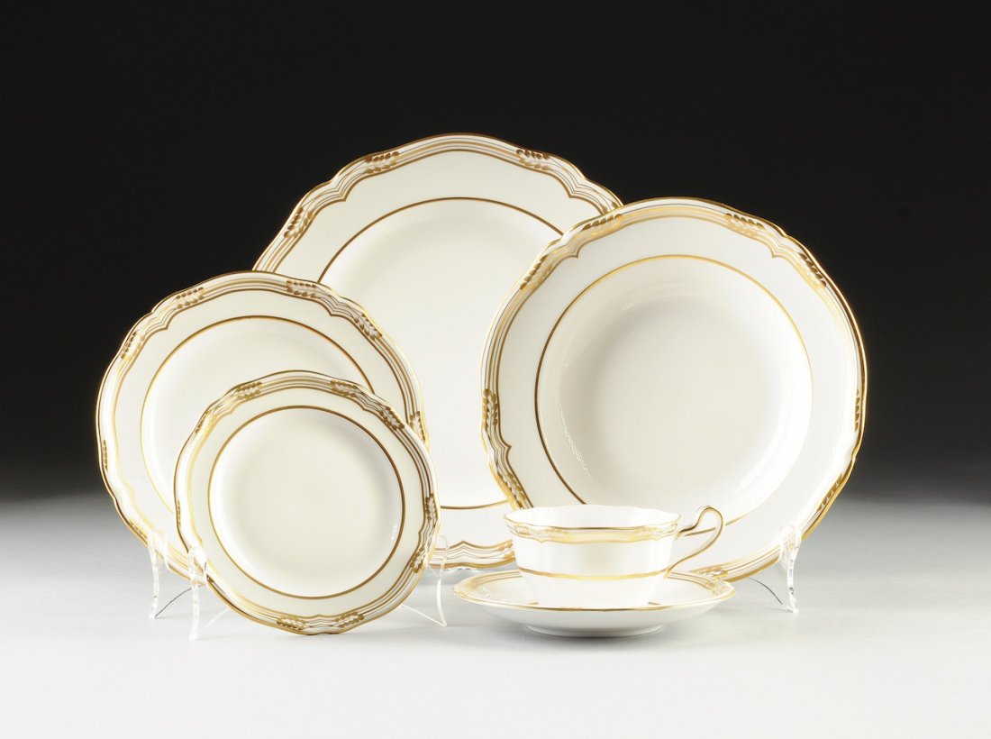 A SPODE EIGHT PLACE DINNER SETTING, SHEFFIELD PATTERN,: A SPODE EIGHT PLACE DINNER SETTING, SHEFFIELD PATTERN, RED AND BLACK MAKER'S MARKS, MODERN, each piece having parcel gilt decoration within a waved rim and comprising; eight tea cups with eight saucer