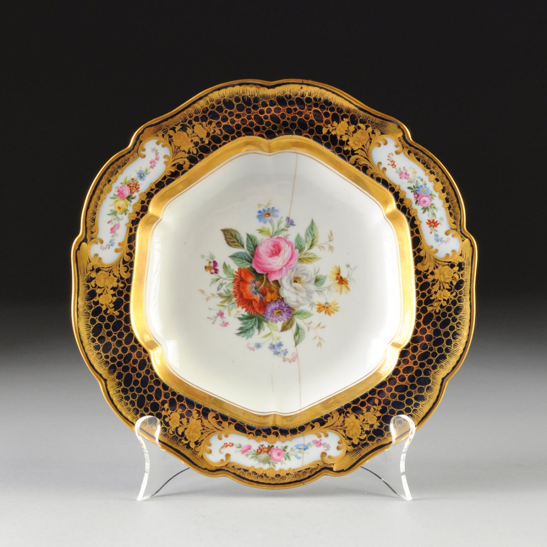 A RUSSIAN PARCEL GILT AND FLORAL PAINTED COBALT GROUND: A RUSSIAN PARCEL GILT AND FLORAL PAINTED COBALT GROUND SOUP BOWL, BY THE IMPERIAL PORCELAIN FACTORY, ST. PETERSBURG, GREEN CROWNED "A II" MARKS, CIRCA 1873, from the Alexander II period (1855-1881), w