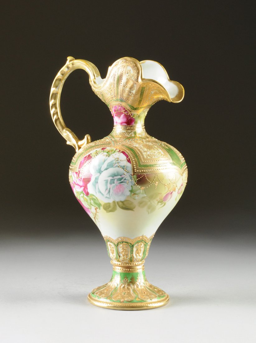 A NIPPON PARCEL GILT AND POLYCHROME PAINTED PORCELAIN: A NIPPON PARCEL GILT AND POLYCHROME PAINTED PORCELAIN EWER, OVERGLAZE GREEN MAPLE LEAF MAKER'S MARK, LATE 19TH/EARLY 20TH CENTURY, the tapering bulbous body with apple green ground enameled sides cent