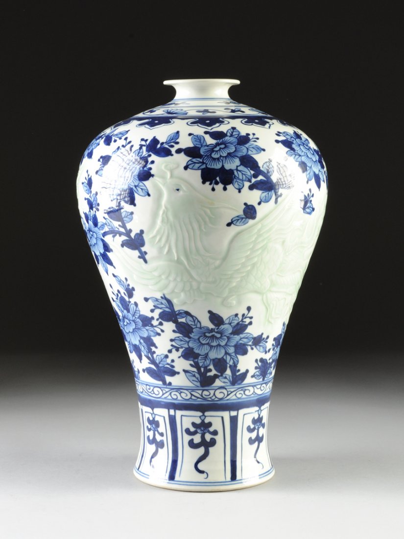 AN UNUSUAL CHINESE BLUE AND WHITE CARVED CELADON GROUND: AN UNUSUAL CHINESE BLUE AND WHITE CARVED CELADON GROUND VASE, MEIPING, UNDERGLAZE BLUE SQUARE SEAL MARK, 20TH CENTURY, the sides depicting a roaring five-claw dragon opposite a spread-winged phoenix w