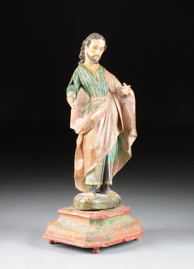 A SPANISH COLONIAL POLYCHROME PAINTED CARVED WOOD: A SPANISH COLONIAL POLYCHROME PAINTED CARVED WOOD SANTOS FIGURE, 19TH CENTURY, possibly depicting John the Baptist in a standing position with arms outstretched and formerly holding attributes, having