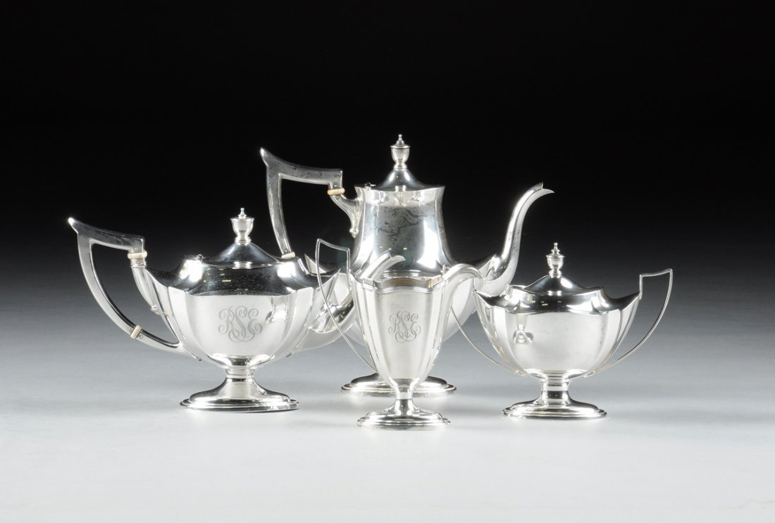 A VINTAGE GORHAM FOUR PIECE STERLING SILVER TEA/COFFEE: A VINTAGE GORHAM FOUR PIECE STERLING SILVER TEA/COFFEE SET, PLYMOUTH PATTERN, IMPRESSED MAKER'S MARKS AND NUMBERS, 1941, each piece having an angular handle on a shaped oval tapering body, with one si