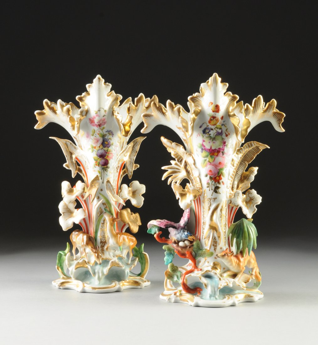A PAIR OF OLD PARIS PARCEL GILT AND POLYCHROME PAINTED: A PAIR OF OLD PARIS PARCEL GILT AND POLYCHROME PAINTED ANIMAL LIFE SPILL VASES, THIRD-QUARTER 19TH CENTURY, in the style of Jacob Petit, each with a flaring stylized leaf form rim above a naturalistic
