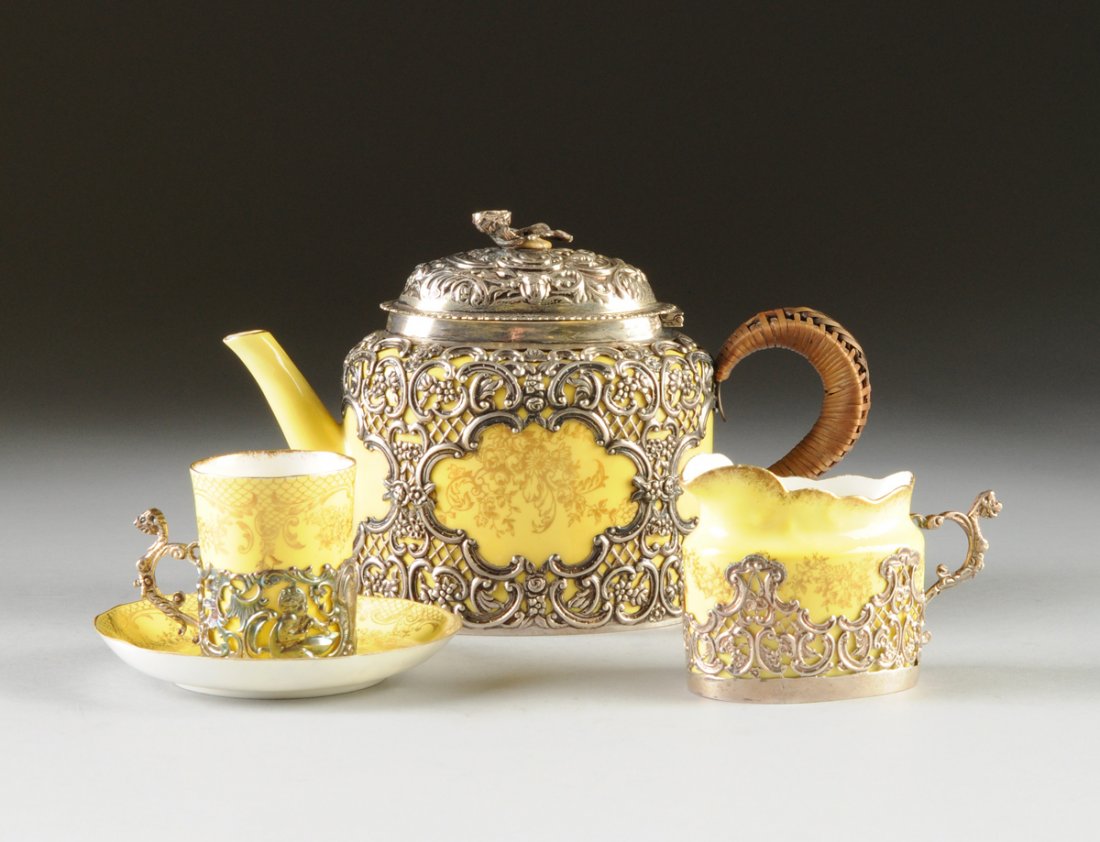 AN ANTIQUE ENGLISH STERLING SILVER MOUNTED CROWN: AN ANTIQUE ENGLISH STERLING SILVER MOUNTED CROWN STAFFORDSHIRE EGGSHELL DEMITASSE SET, SILVERSMITH POSSIBLY WILLIAM COMYNS, LONDON, BIRMINGHAM, 1897, 1898, in the Rococo Revival taste, each piece of y
