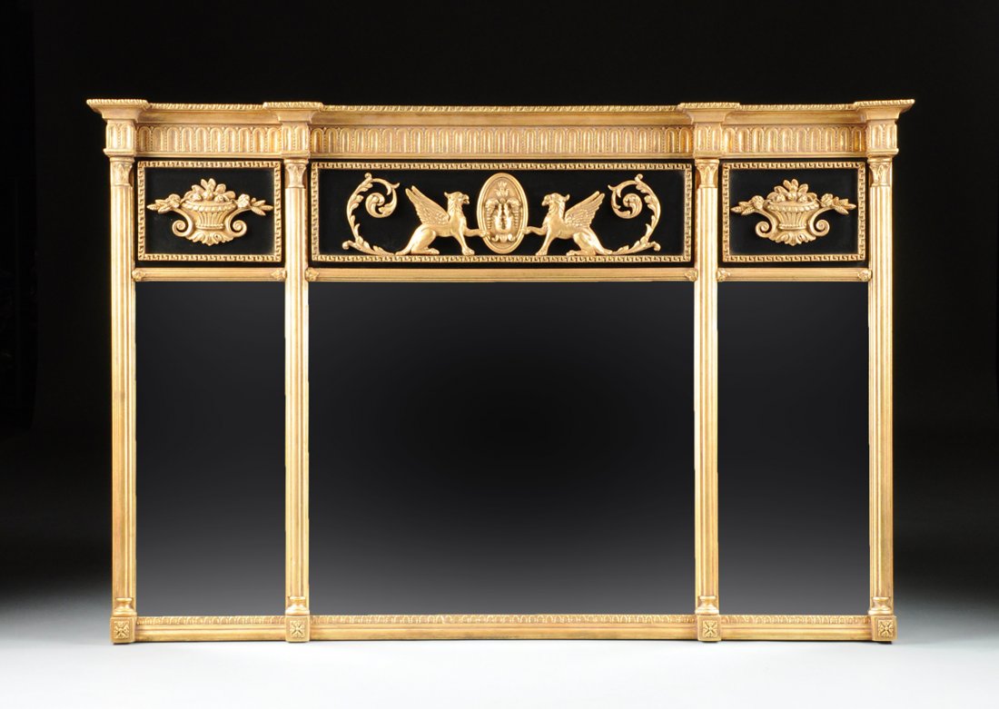 A CLASSICAL STYLE PARCEL GILT AND EBONIZED CARVED WOOD: A CLASSICAL STYLE PARCEL GILT AND EBONIZED CARVED WOOD OVER MANTLE MIRROR, MODERN, the breakfront rectangular cornice with gadrooned trim above scalloped banding and a three panel frieze centering two