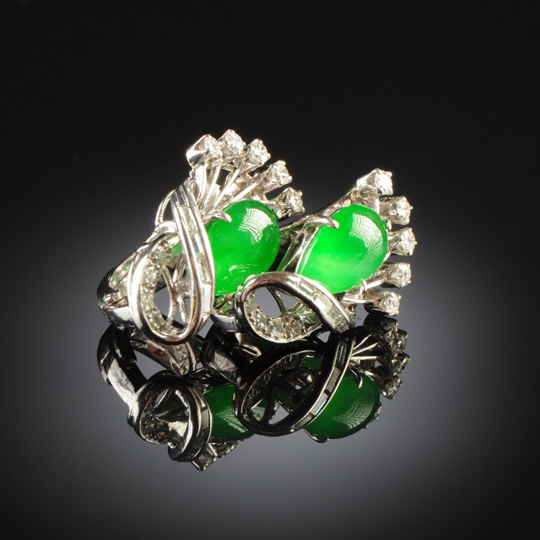 A PAIR OF 14K WHITE GOLD CHINESE "A" JADEITE JADE AND: A PAIR OF 14K WHITE GOLD CHINESE "A" JADEITE JADE AND DIAMOND LADY'S EARRINGS, with natural, type "A" jadeite jade pear shape cabochons measuring approximately 6 x 10 x 3.3 millimeters, fine green col