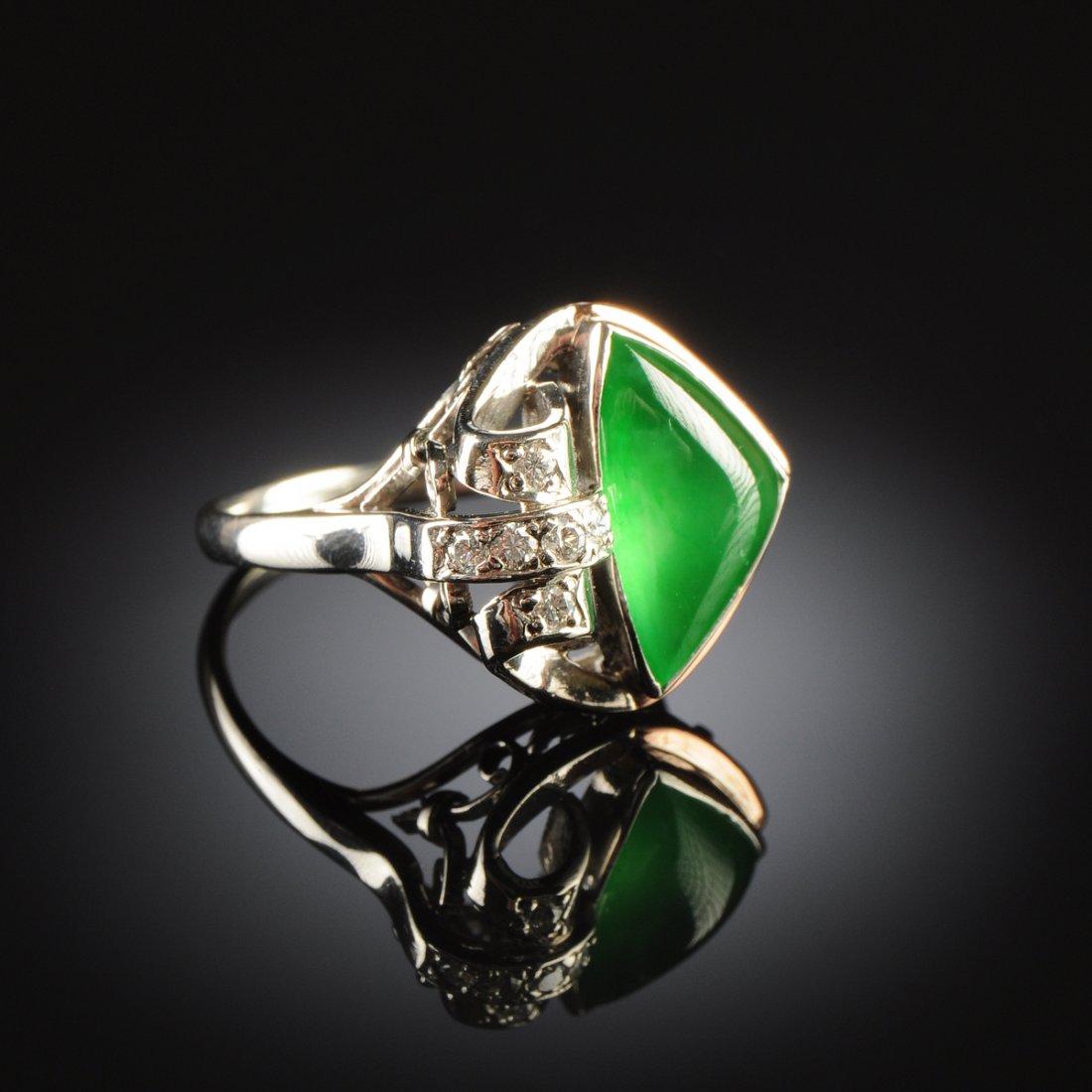 A CHINESE "A" JADEITE JADE AND DIAMOND LADY'S RING,: A CHINESE "A" JADEITE JADE AND DIAMOND LADY'S RING, a handmade ring mounting in white gold with natural, type "A" jadeite jade triangle measuring approximately 9.1 x 14.0 x 4.9 millimeters, very fine