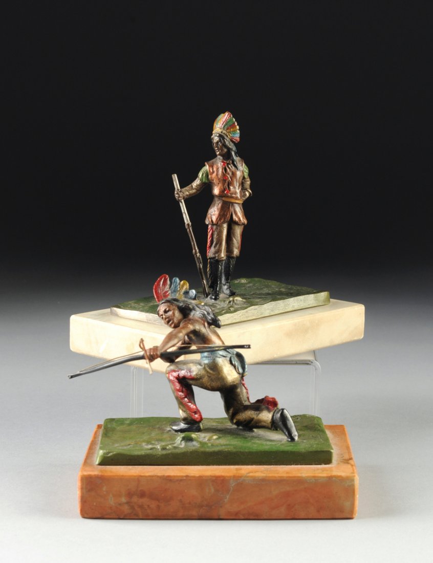 after CARL KAUBA (AUSTRIAN 1865-1922) A PAIR OF: after CARL KAUBA (AUSTRIAN 1865-1922) A PAIR OF MINIATURE POLYCHROME COLD PAINTED FIGURES OF NATIVE AMERICANS, each signed in the bronze, on rectangular marble plinths, height: 4 1/2", 3 1/8".