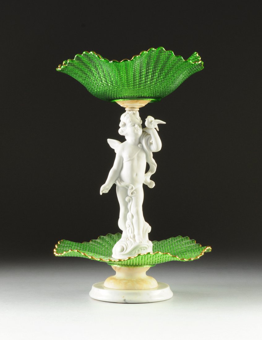 AN ITALIAN TWO TIER GREEN GLASS AND BISCUIT PORCELAIN: AN ITALIAN TWO TIER GREEN GLASS AND BISCUIT PORCELAIN CENTERPIECE, 20TH CENTURY, with a white biscuit porcelain cherub figural stem on a ruffled transparent green glass dish, surmounted by a ruffled t
