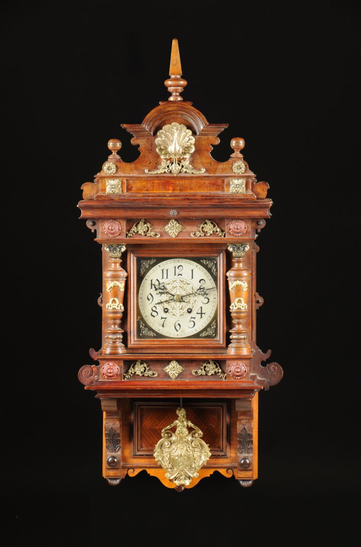 A GERMAN RENAISSANCE REVIVAL GILT BRASS MOUNTED WALNUT: A GERMAN RENAISSANCE REVIVAL GILT BRASS MOUNTED WALNUT AND VARIOUS WOODS WALL CLOCK, BY LENZKIRCH, NUMBERED 121892, 1 MILLION, LATE 19TH CENTURY, the circular silvered metal ring dial with black Arabi