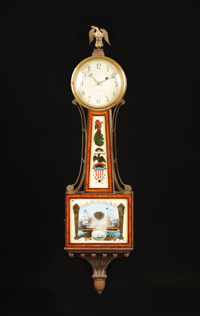 A FEDERAL STYLE POLYCHROME PAINTED VERRE ÉGLOMISÉ AND: A FEDERAL STYLE POLYCHROME PAINTED VERRE ÉGLOMISÉ AND MAHOGANY BANJO CLOCK, BY E. HOWARD & CO., BOSTON, the circular white painted dial with black Arabic hour chapters, signed "E. HOWARD & CO. BOSTO