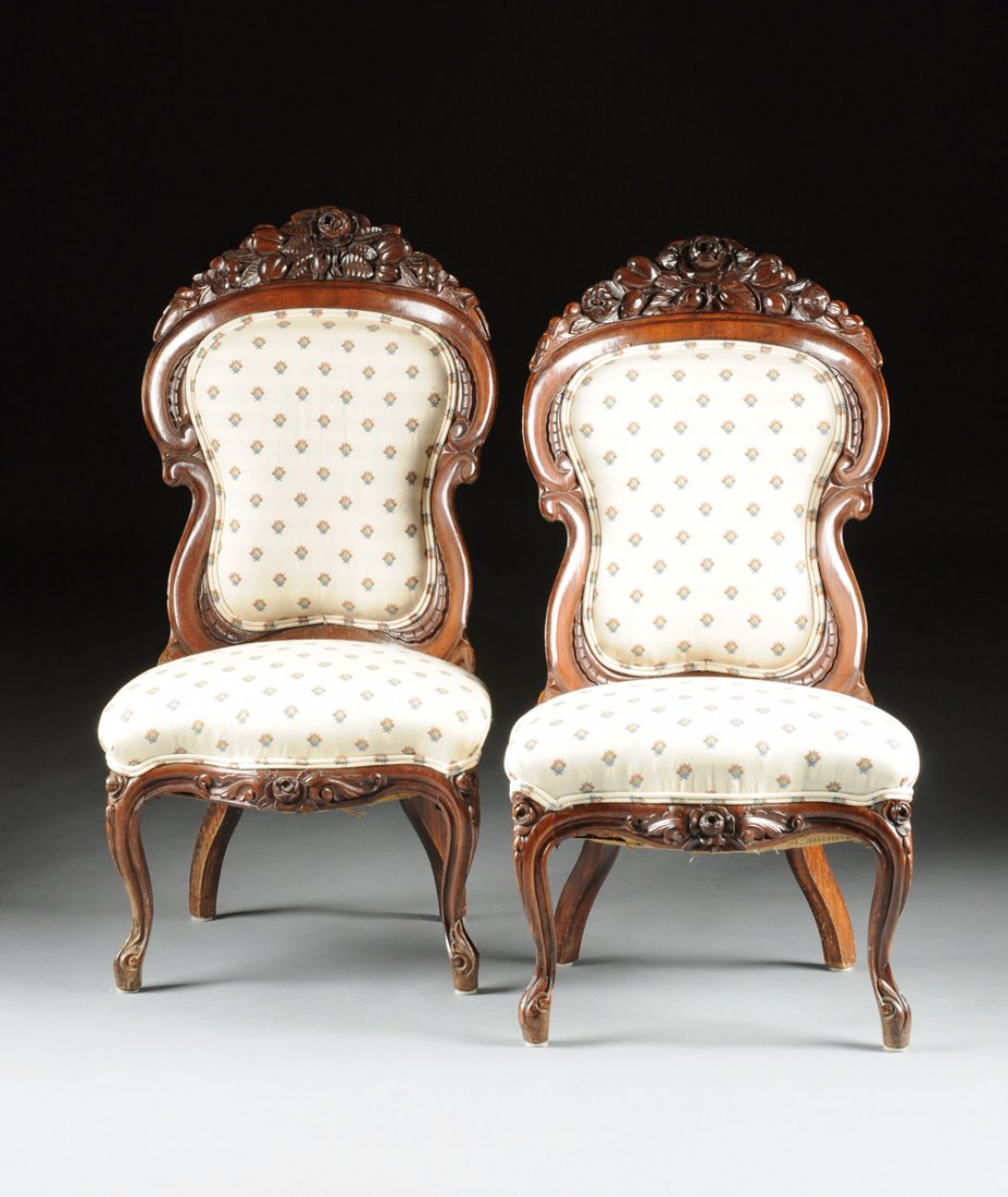 PAIR OF BELTER LAMINATED CHAIRS IN HENRY CLAY PATTERN.: A PAIR OF AMERICAN ROCOCO REVIVAL ROSEWOOD PARLOR CHAIRS, by JOHN HENRY BELTER (1804-1863), NEW YORK CITY (1850-1860), in the Henry Clay pattern. Each with an arched crestrail of blossoming fruit deta