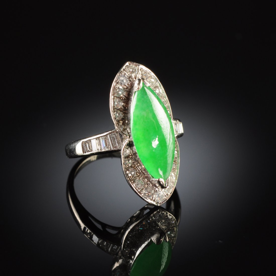 A 14K WHITE GOLD, CHINESE 'A' JADEITE JADE, AND DIAMOND: A 14K WHITE GOLD, CHINESE 'A' JADEITE JADE, AND DIAMOND LADY"S RING, the setting with natural, type 'A' jadeite jade marquise measuring approximately 6.6 x 14.5 x 3.5 millimeters, very fine green colo