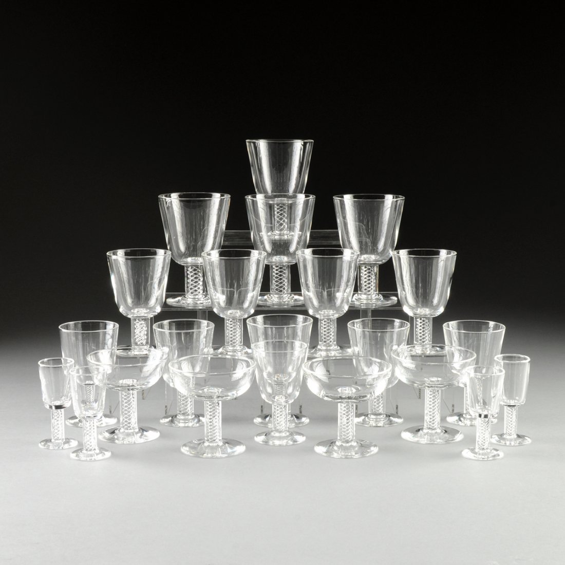 A TWENTY-TWO PIECE STEUBEN AIR TWIST STEMWARE SET,: A TWENTY-TWO PIECE STEUBEN AIR TWIST STEMWARE SET, DESIGNER GEORGE THOMPSON, THIRD QUARTER 20TH CENTURY, each piece in traditional pattern and hand engraved "Steuben" on underside, comprising; four wa