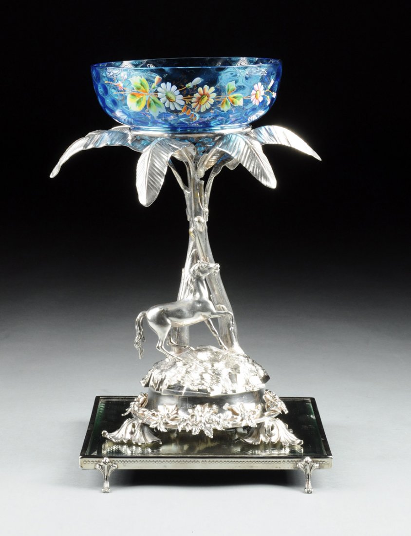 A VICTORIAN SILVER PLATED FIGURAL CENTERPIECE WITH: A VICTORIAN SILVER PLATED FIGURAL CENTERPIECE WITH ASSOCIATED COBALT BLUE GLASS BOWL AND MIRROR TOPPED SILVER PLATED PLATEAU, PROBABLY SHEFFIELD, ENGLAND, CIRCA 1880, the centerpiece with two entwined