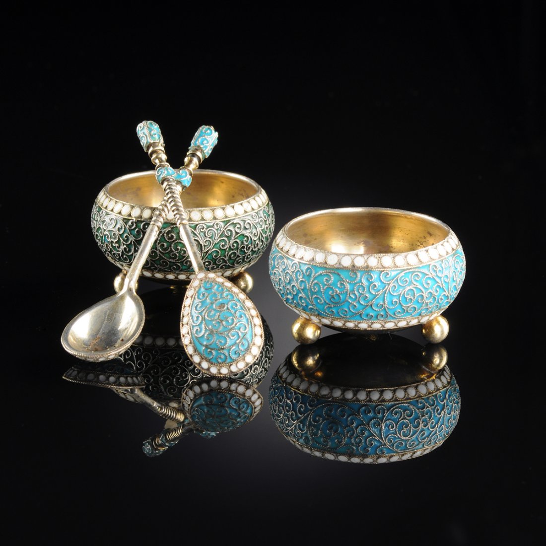 A PAIR OF GUSTAV KLINGERT RUSSIAN SILVER GILT AND: A PAIR OF GUSTAV KLINGERT RUSSIAN SILVER GILT AND CLOISONNÉ ENAMEL OPEN SALTS AND SPOONS, MOSCOW, 1893, cushion form with turquoise cloisonné enamel and gilt scroll decoration between white beaded b