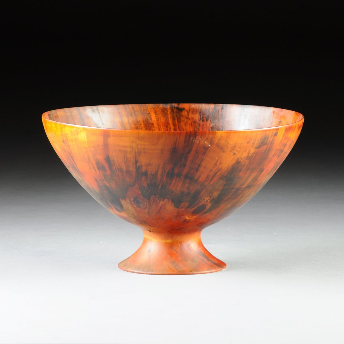 RON KENT (American b.1931): RON KENT (American b.1931)A NORFOLK ISLAND PINE CENTER BOWL, 20TH CENTURY, semi-translucent turned wooden bowl, having a flared footed base, signed on the bottom. Diameter 21" Height 13 3/4"