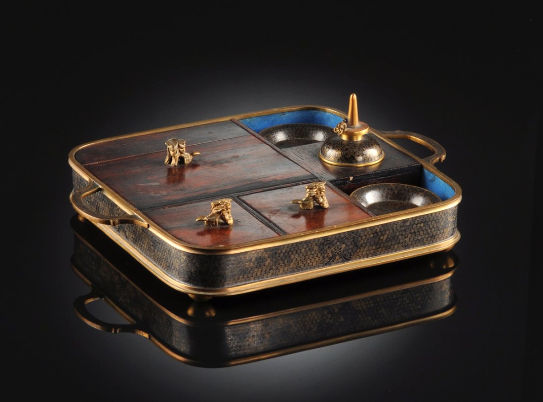 A CHINESE CLOISONNÉ ENAMELED BRONZE AND HARDWOOD FITTED: A CHINESE CLOISONNÉ ENAMELED BRONZE AND HARDWOOD FITTED OPIUM SET, CIRCA 1900, of two handled rounded rectangular form and sides centering cloisonné enamel scrolling line details and stylized butter