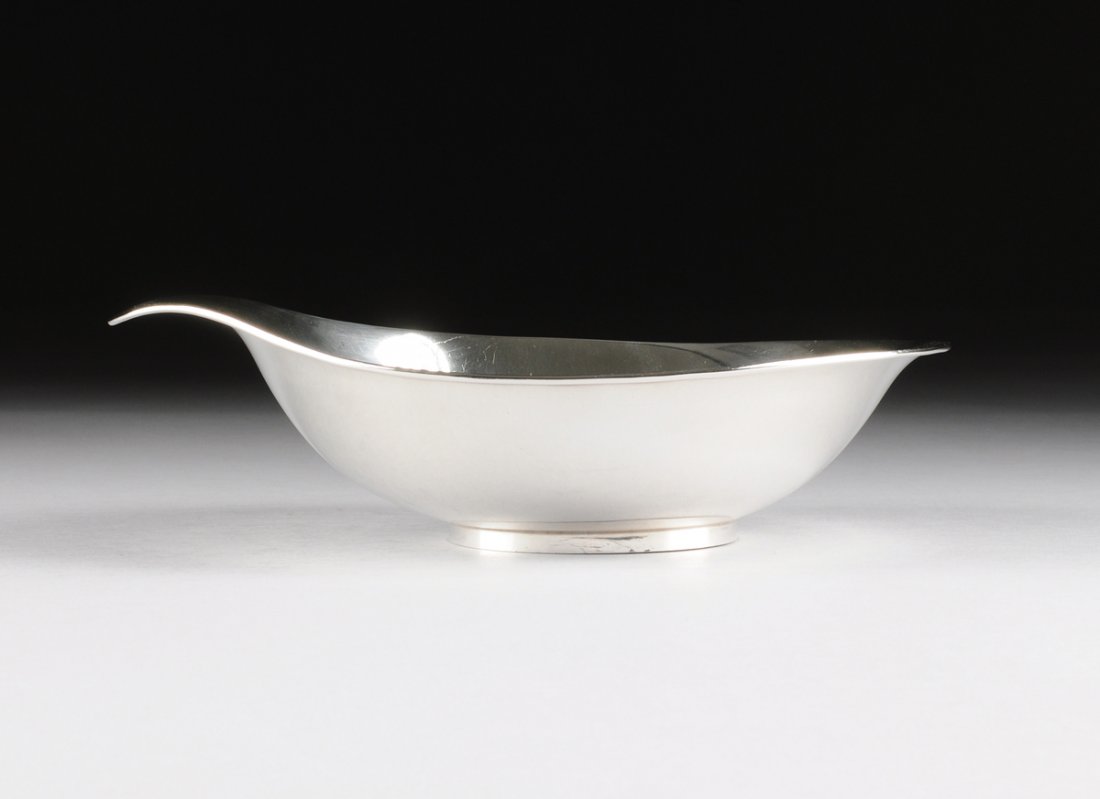 ALLAN ADLER (American 1916-2002) A STERLING SILVER: ALLAN ADLER (American 1916-2002) A STERLING SILVER CENTERPIECE BOWL, LOS ANGELES, CALIFORNIA, CIRCA 1960, of oval form raised on ring base, one side with tab handle, marks: "ALLAN ADLER," "STERLING,"