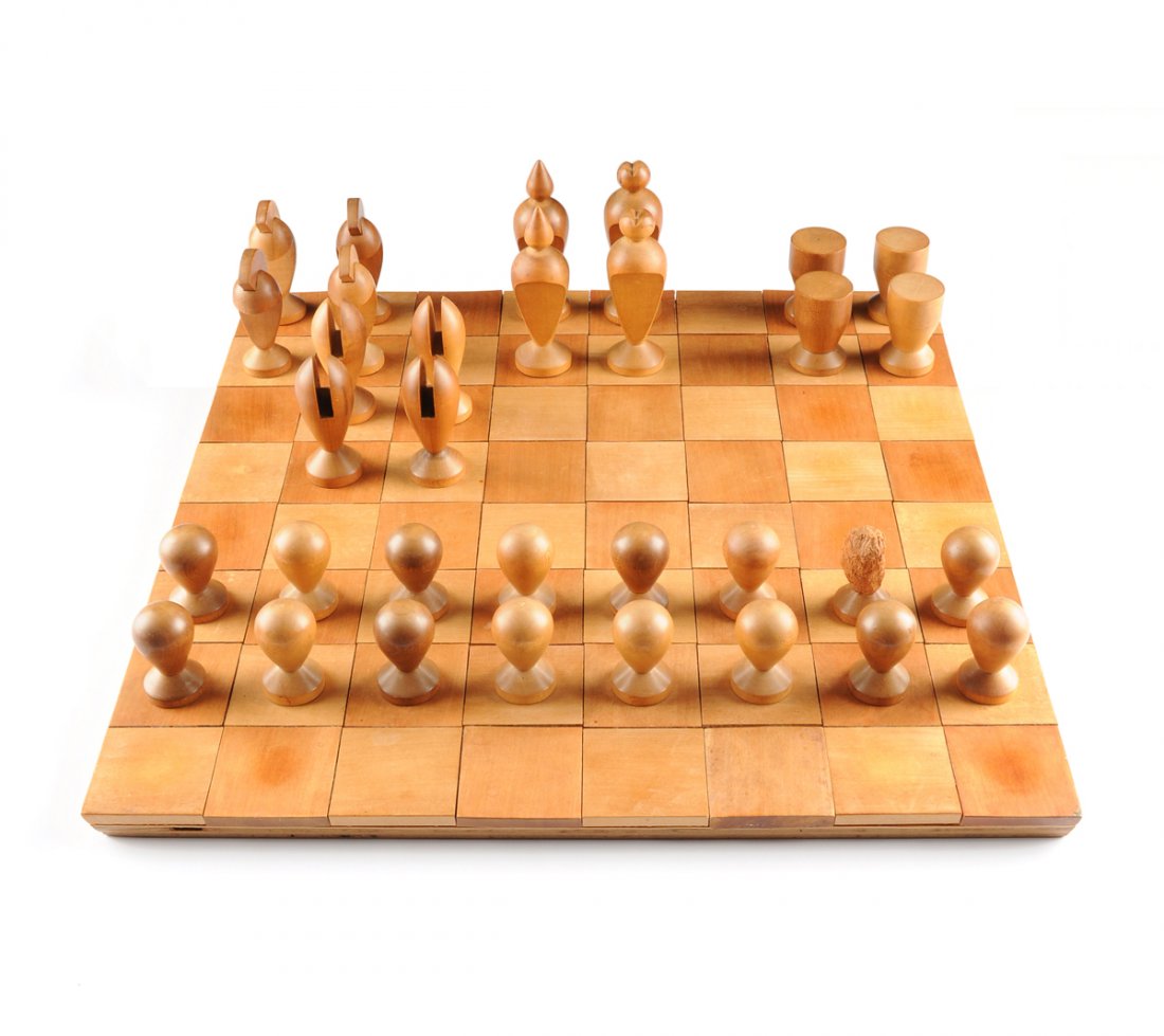 ELLIOTT FRANZ SANDOW (American 1910-1976) A THIRTY: ELLIOTT FRANZ SANDOW (American 1910-1976) A THIRTY-THREE PIECE VINTAGE AMERICAN CARVED WOOD CHESS SET, SIGNED, NUMBER 5, BIG SUR, CALIFORNIA, CIRCA 1950, comprising thirty two carved wood game pieces,