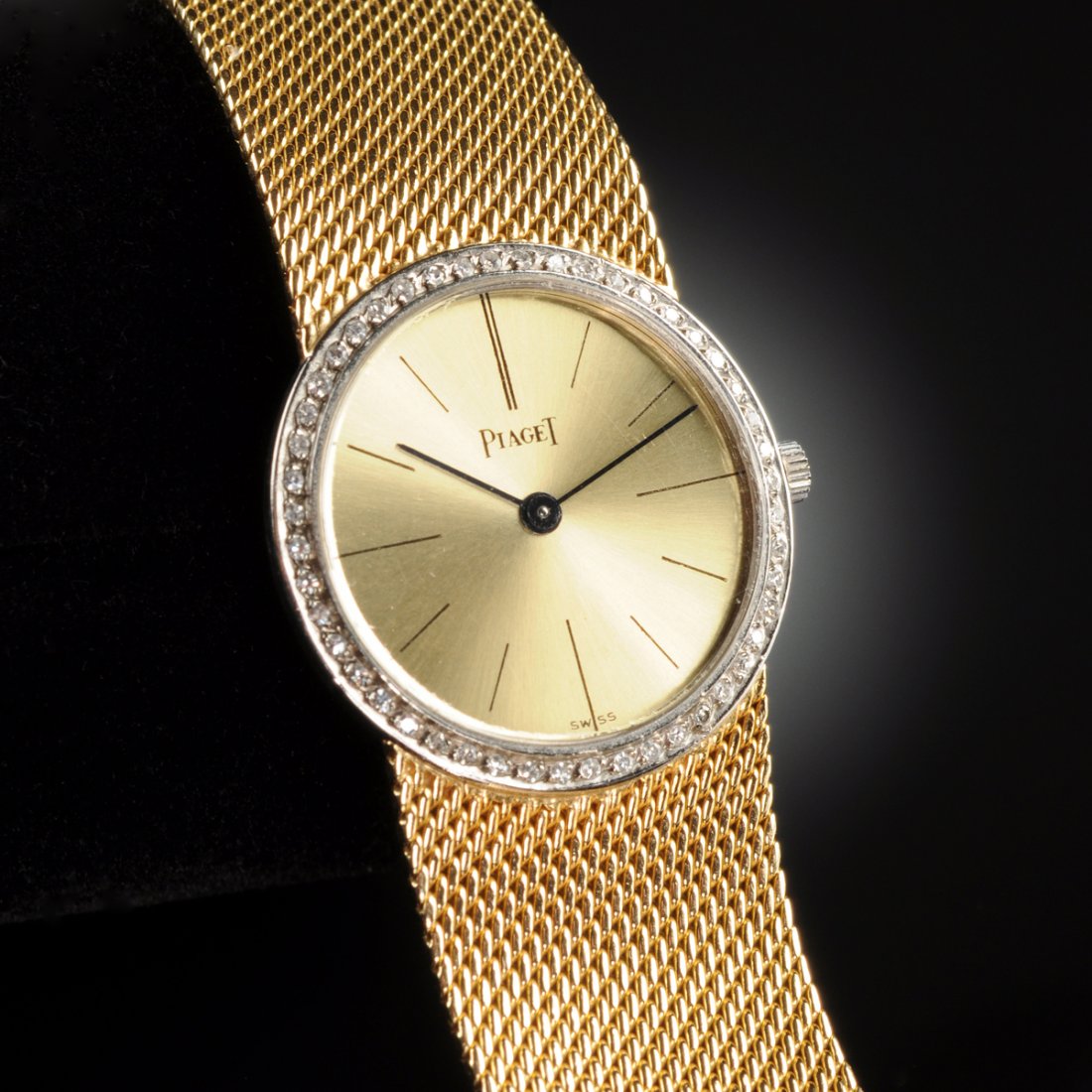 AN 18K YELLOW GOLD AND DIAMOND PIAGET LADY'S WATCH,: AN 18K YELLOW GOLD AND DIAMOND PIAGET LADY'S WATCH, with attached mesh bracelet. Diamond bezel Ref. 928, 87612, with Piaget 9P2 18 jewel movement. Approximate weight 38.1 grams.